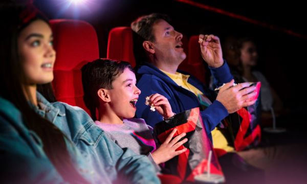 Family enjoying a cinema trip on a rainy day